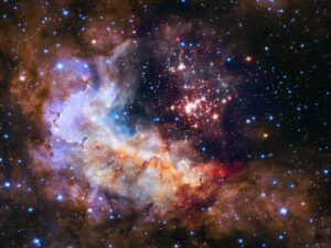 This image shows the central region of star cluster Westerlund 2 taken by the NASA/ESA Hubble Space Telescope. The image’s central region, containing the star cluster, blends visible-light data taken by the Advanced Camera for Surveys and near-infrared exposures taken by the Wide Field Camera 3. The surrounding region is composed of visible-light observations taken by the Advanced Camera for Surveys. This image of the cluster and its surroundings has been released to celebrate Hubble’s 25th year in orbit and a quarter of a century of new discoveries, stunning images and outstanding science.